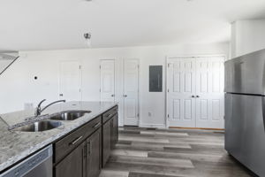 Never miss out on a thing & enjoy entertaining on game day with this seamless integration of the kitchen into the traditional living space.