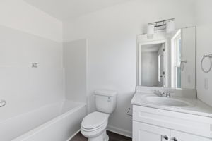 Primary suite full bathroom with tub/shower combo.