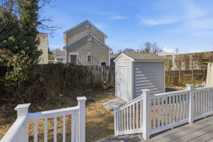 Back yard with brand new detached storage shed with low maintenance hardi-plank siding.