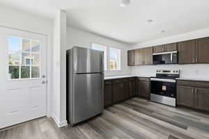 This spacious kitchen has plenty of counter and cabinet space to make preparing all your meals a breeze!