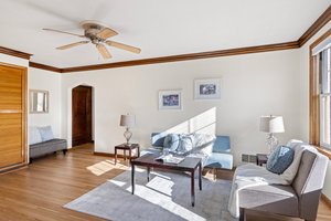 Step into a living space brimming with charm, where original details shine and newly refinished hardwoods add warmth and character. A perfect blend of vintage elegance and modern refinement.