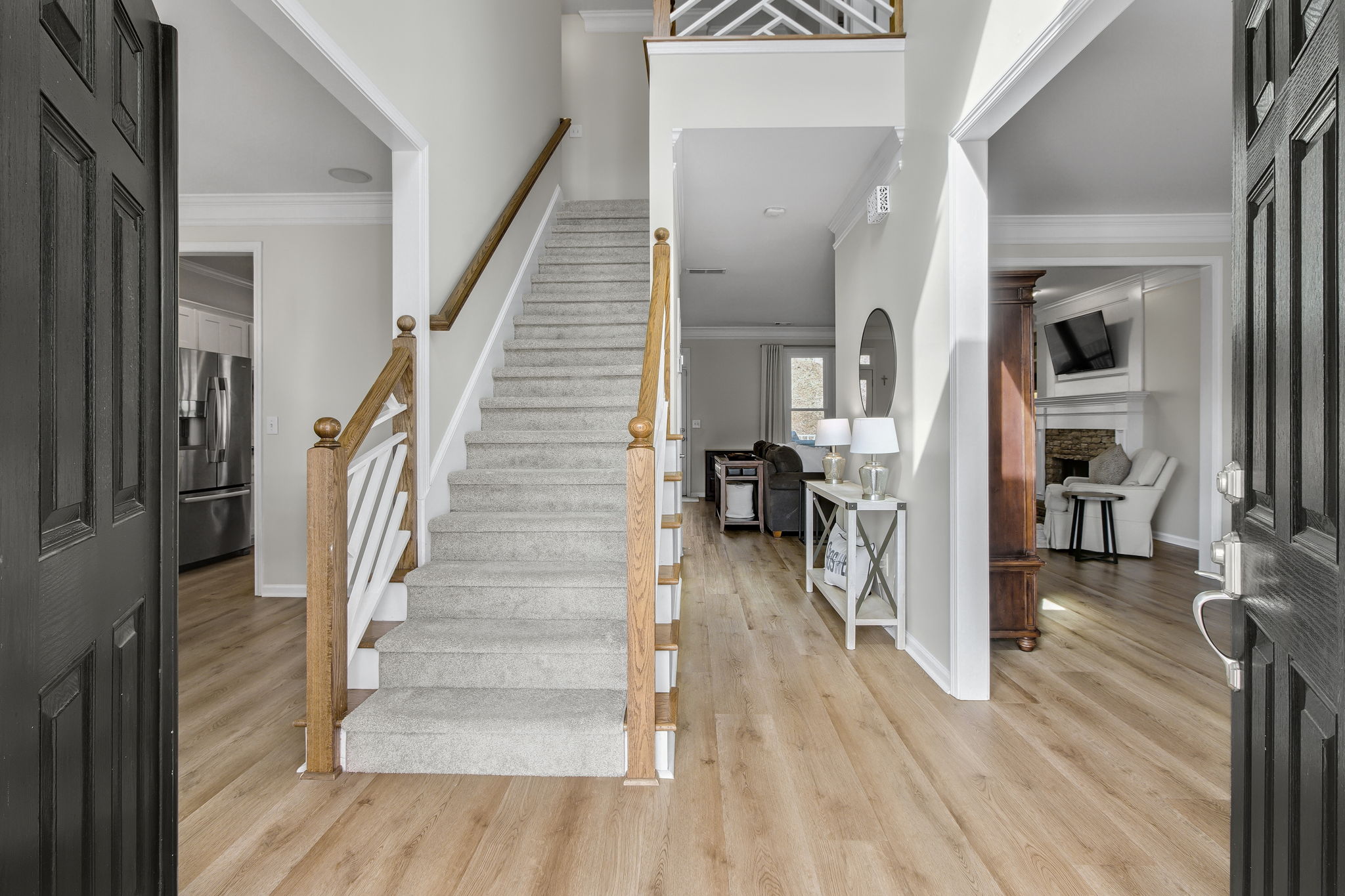 Step inside to soaring ceilings, elegant wood accents, and an open floor plan that immediately feels like home. The natural light enhances the spaciousness, creating an inviting and airy atmosphere.