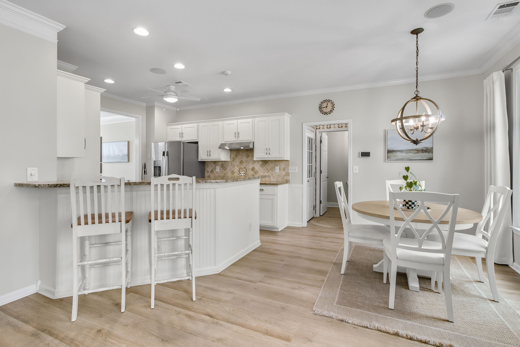 Beautiful white kitchen with refaced cabinets.