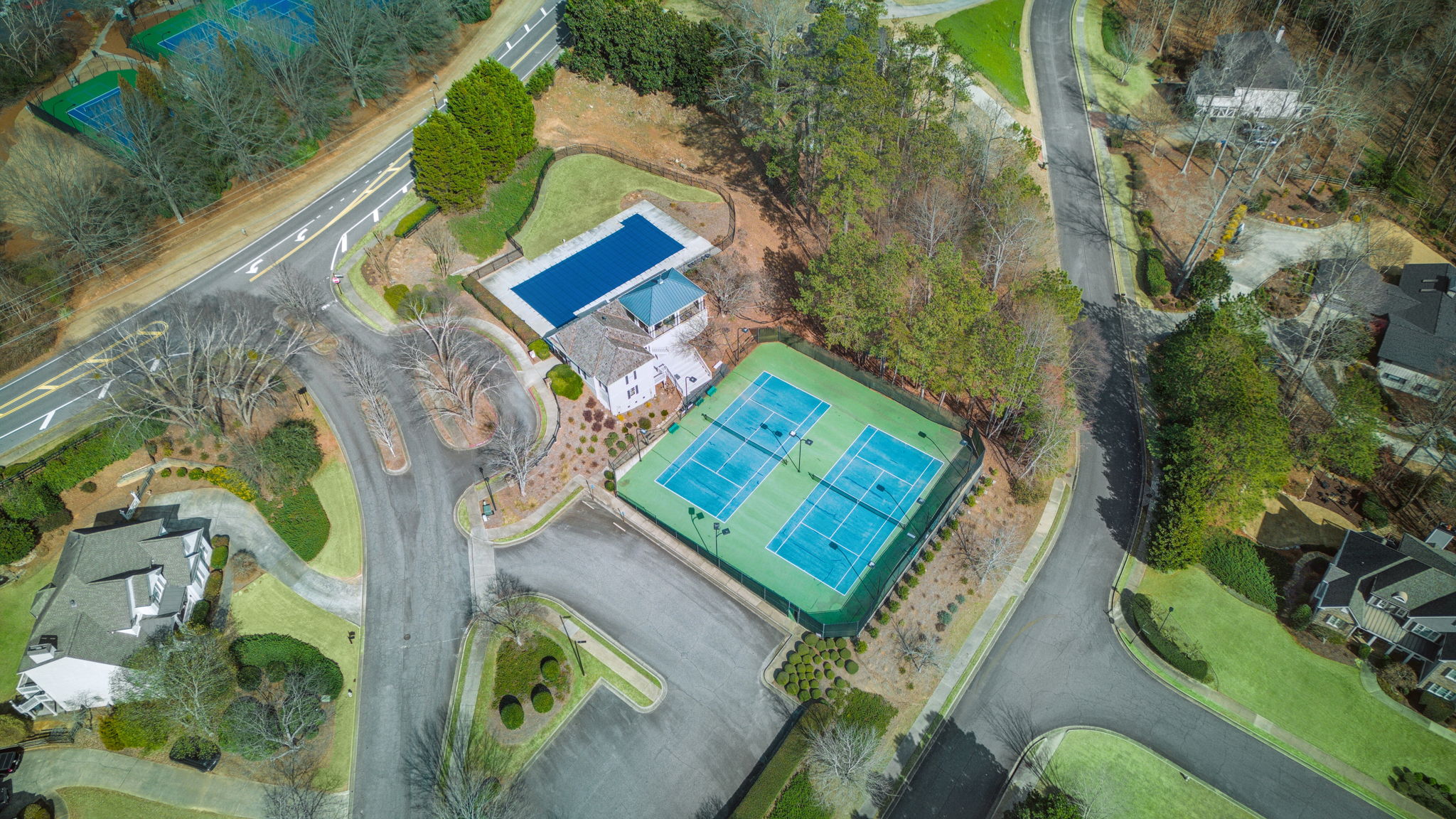 Beautifully maintained community tennis courts and clubhouse provide a perfect space for recreation and social gatherings.