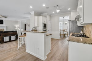 Overlooking the living room and breakfast area, the kitchen is perfect for entertaining while preparing meals, with bar seating providing a convenient spot for casual dining.