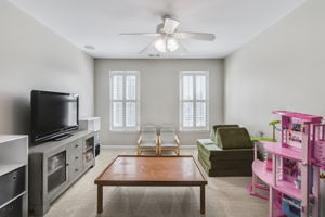 There is a door for access to attic/crawl space for plenty of storage behind the doll house.