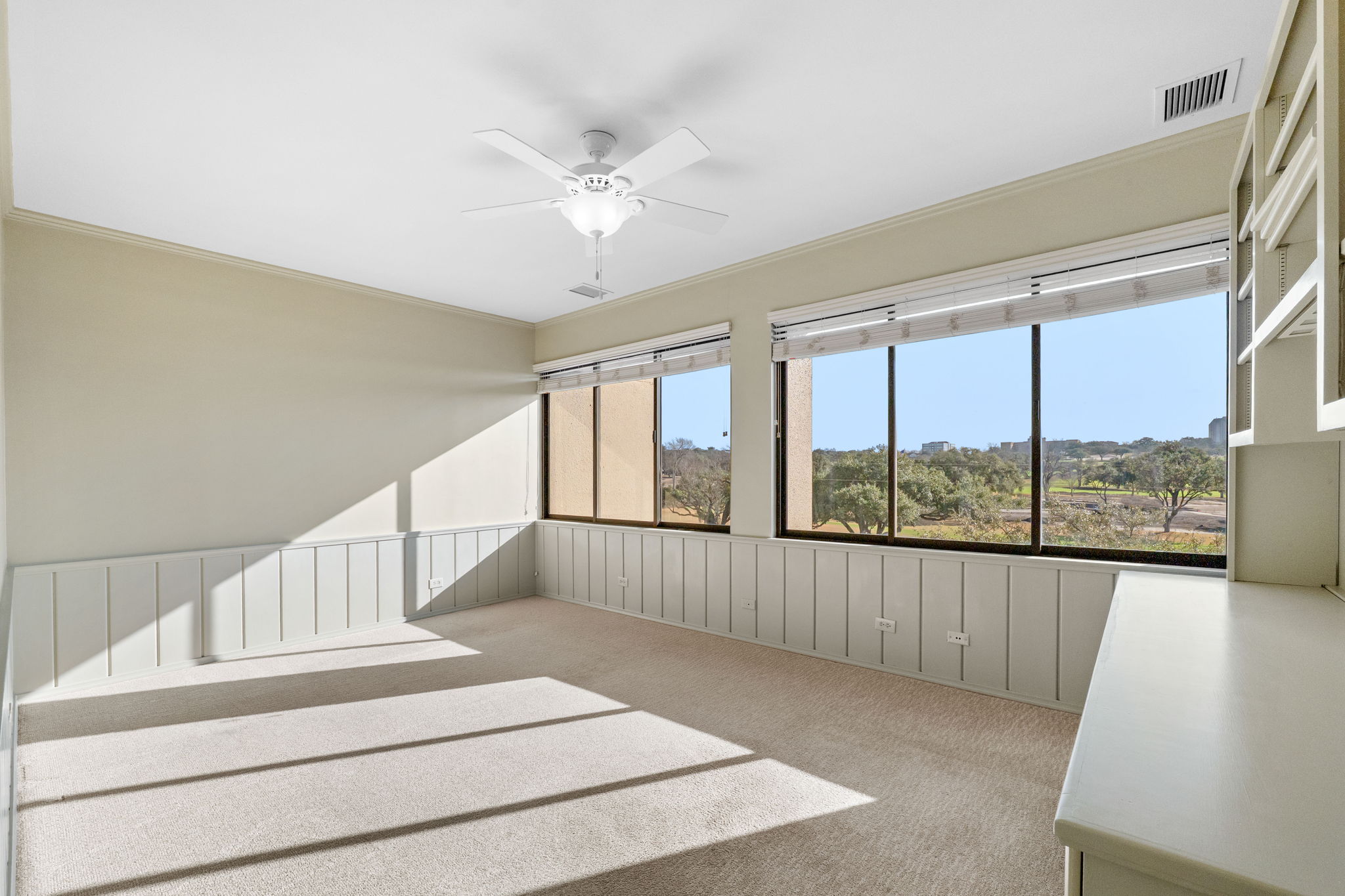 2nd bedroom with built-in book shelves and work station can also be an office or hobby room