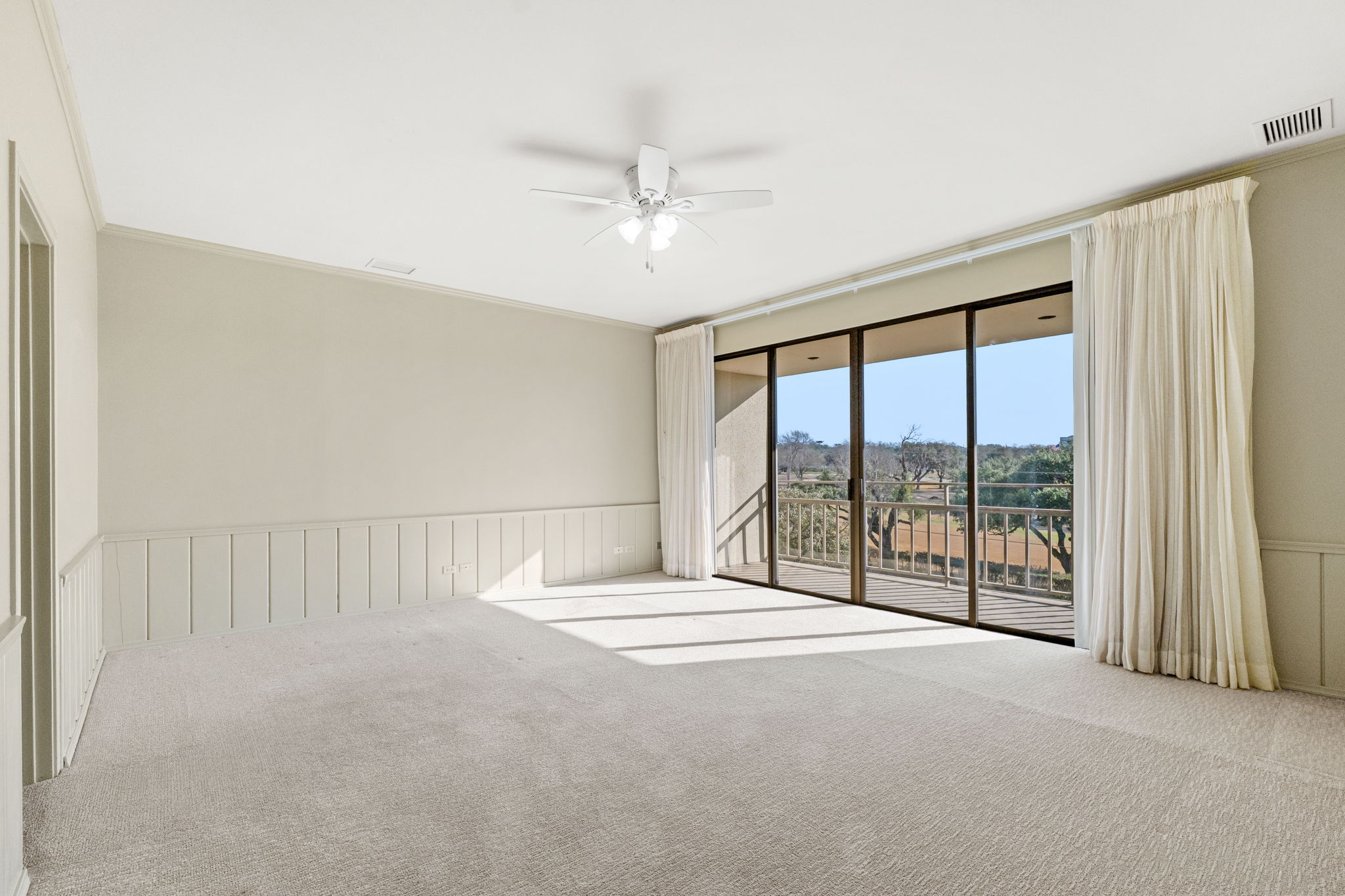 Large primary suite with balcony overlooking San Antonio Country Club golf course