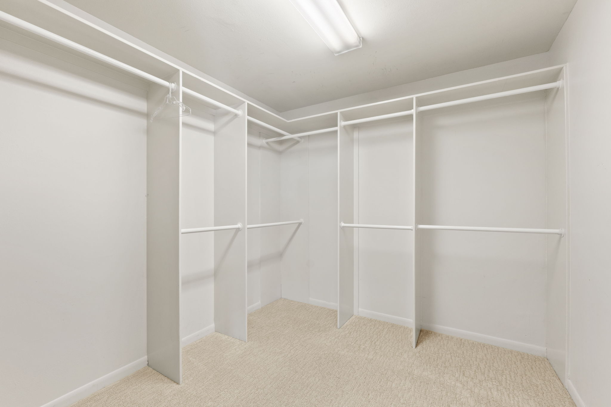The incredible primary closet with ironing station