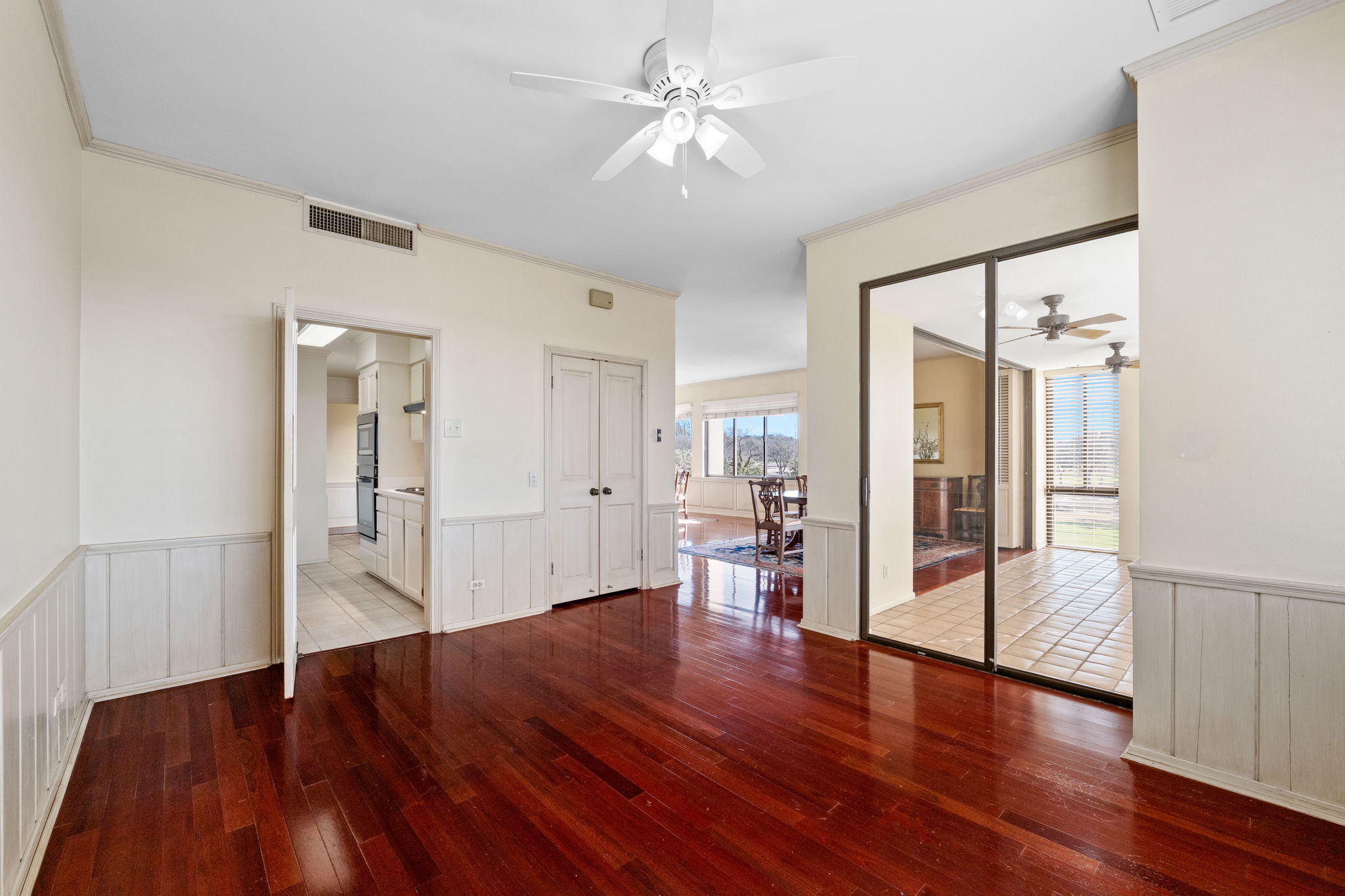 The family room is ideal for watching TV. This room includes a built-in entertainent center or bar