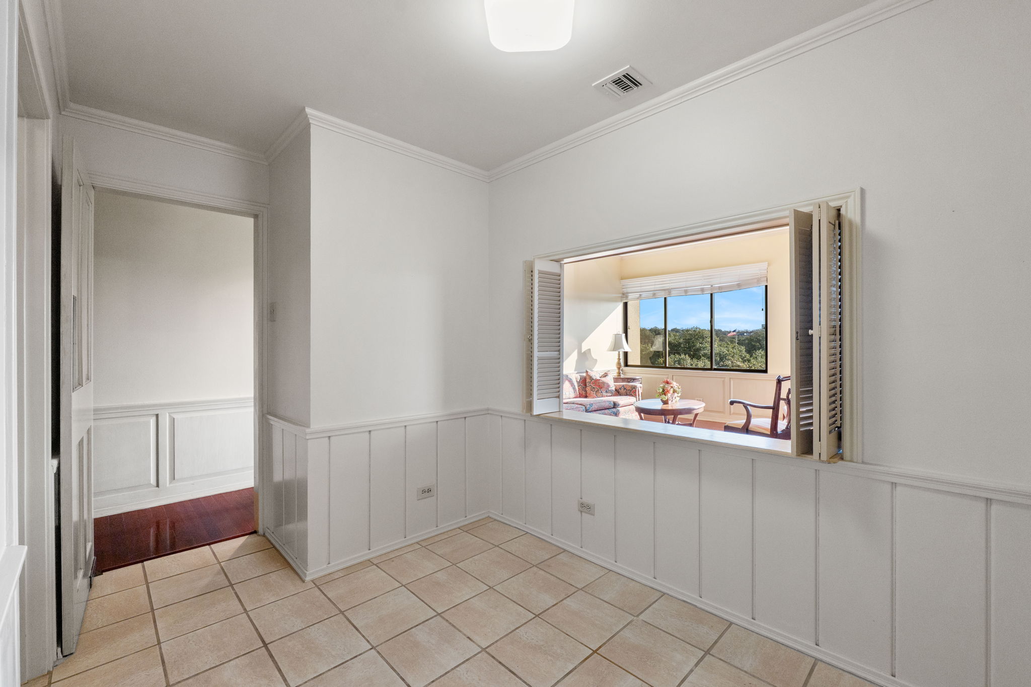 The delightful breakfast nook with pass-through to the living room