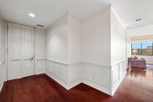 Unit 300 features a lovely, wide entyway leading to the light-filled living spaces