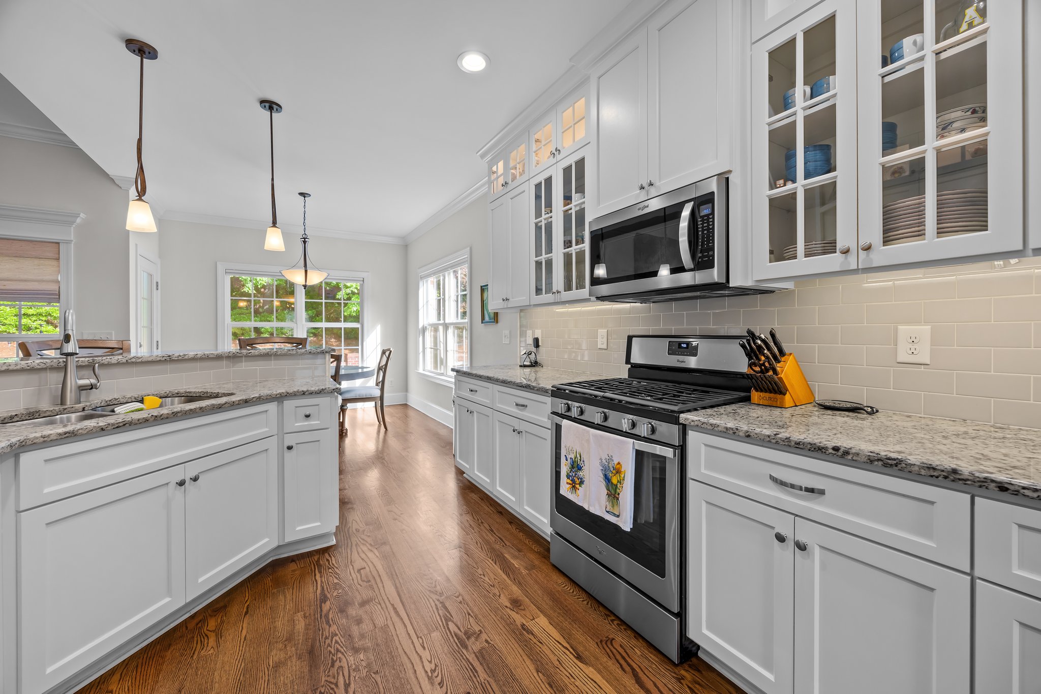 Lots of soft close cabinets & granite counter space, gas range