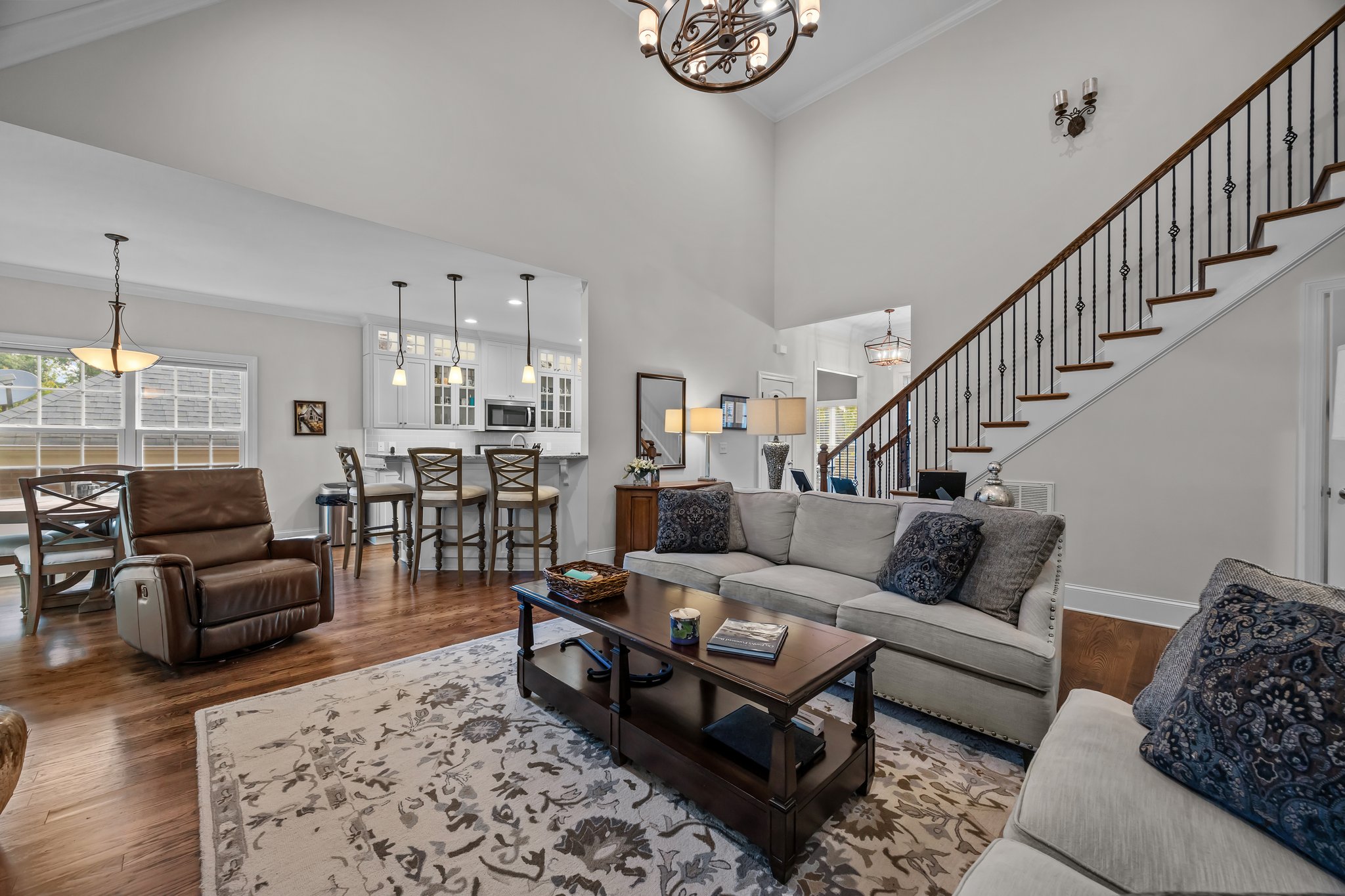 Open hardwood staircase with iron balusters