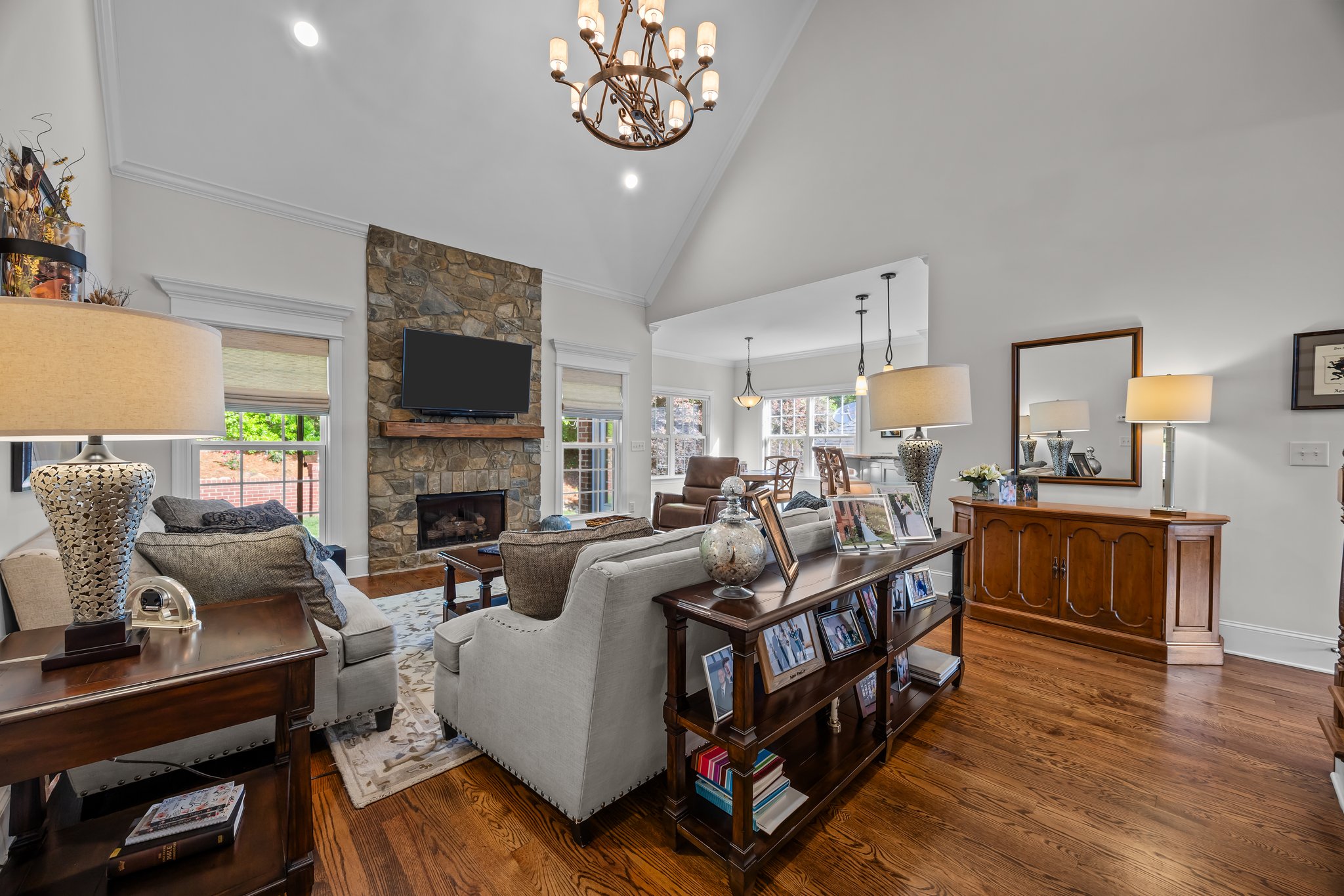 Floor-to-ceiling stone fireplace, gas logs, custom mantle