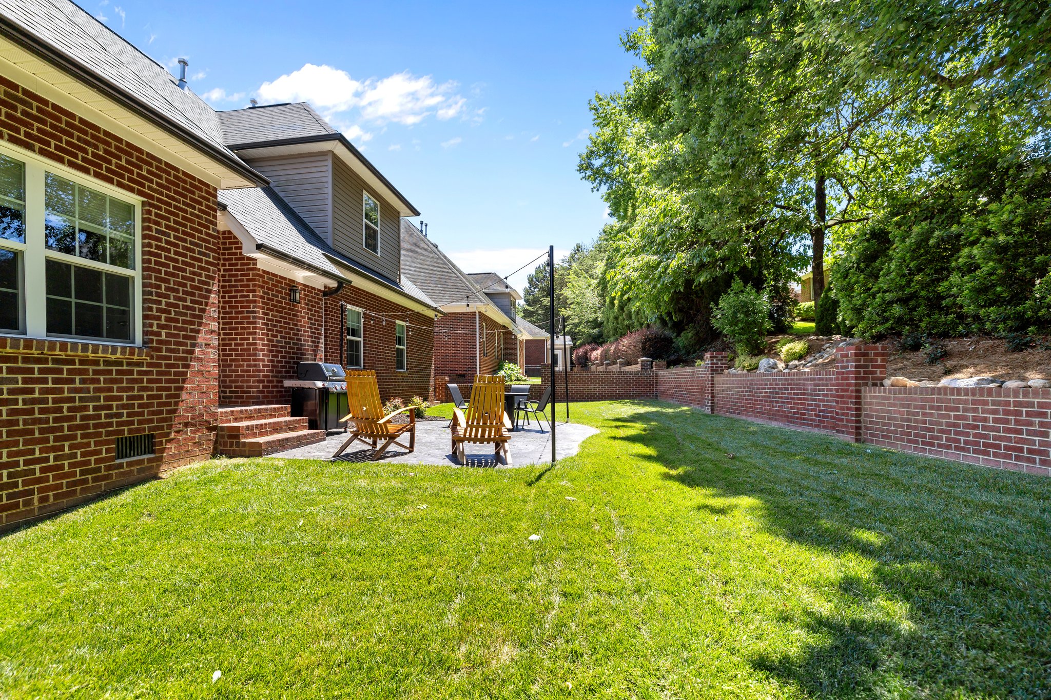 French drain installed behind brick retaining wall