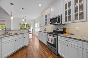 Lots of soft close cabinets & granite counter space, gas range