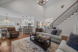 Open hardwood staircase with iron balusters