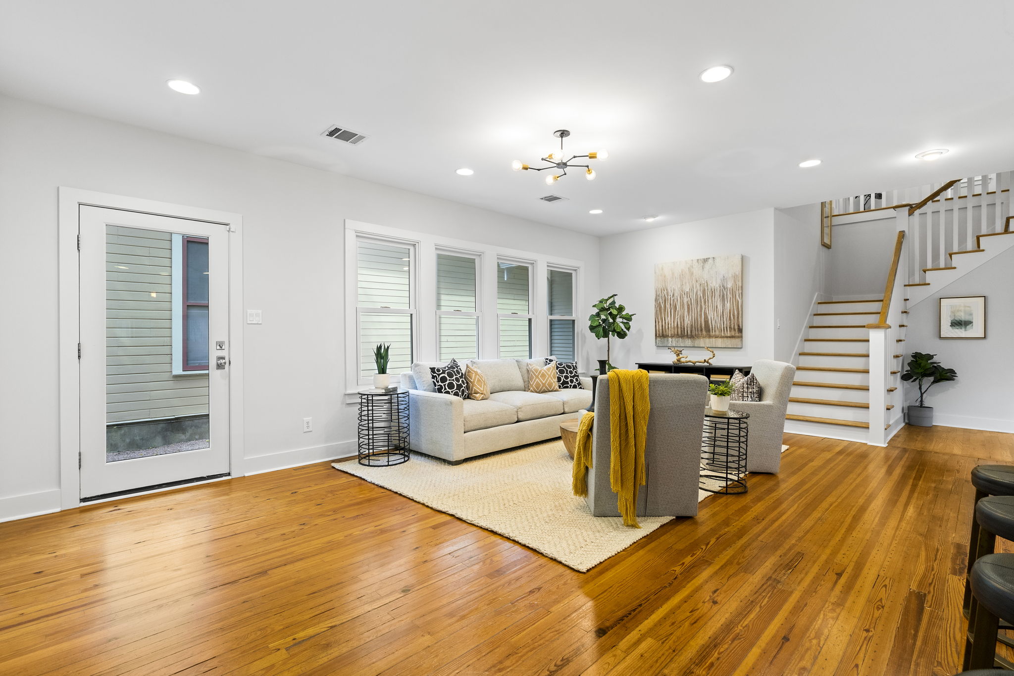 An alternate angle of the living room provides a view of the side door and side yard.