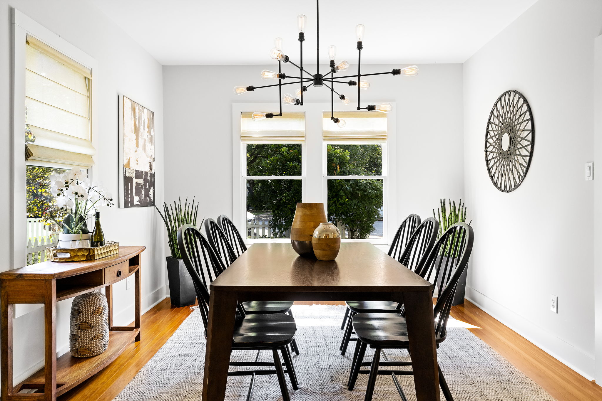 The spacious dining area overlooks the large front yard, creating an ideal setting for gatherings with loved ones.