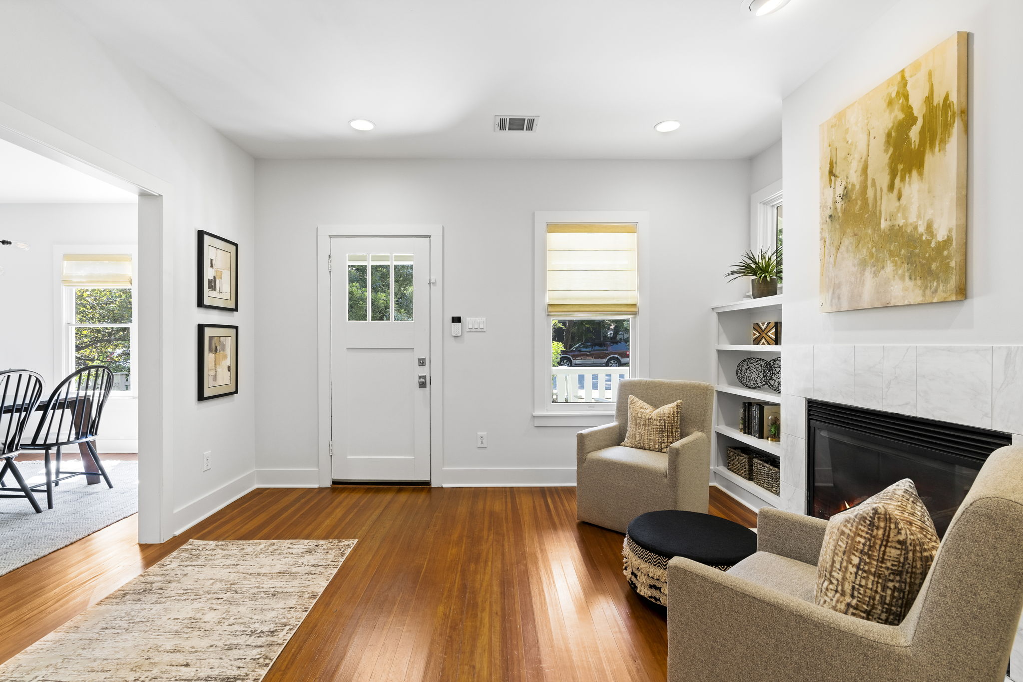 A different perspective reveals the foyer, showcasing a view toward the front door and dining room beyond.