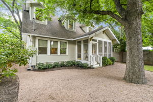 Discover the partially xeriscaped backyard, where easy upkeep is complemented by the shade provided by beautiful live oak trees.