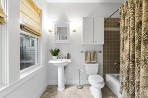 In the extra bathroom, you'll discover abundant space for your daily preparations, adorned with sophisticated accents.