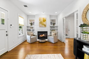 Enjoy the beautiful foyer with a cozy fireplace, creating a warm and inviting space for relaxation.