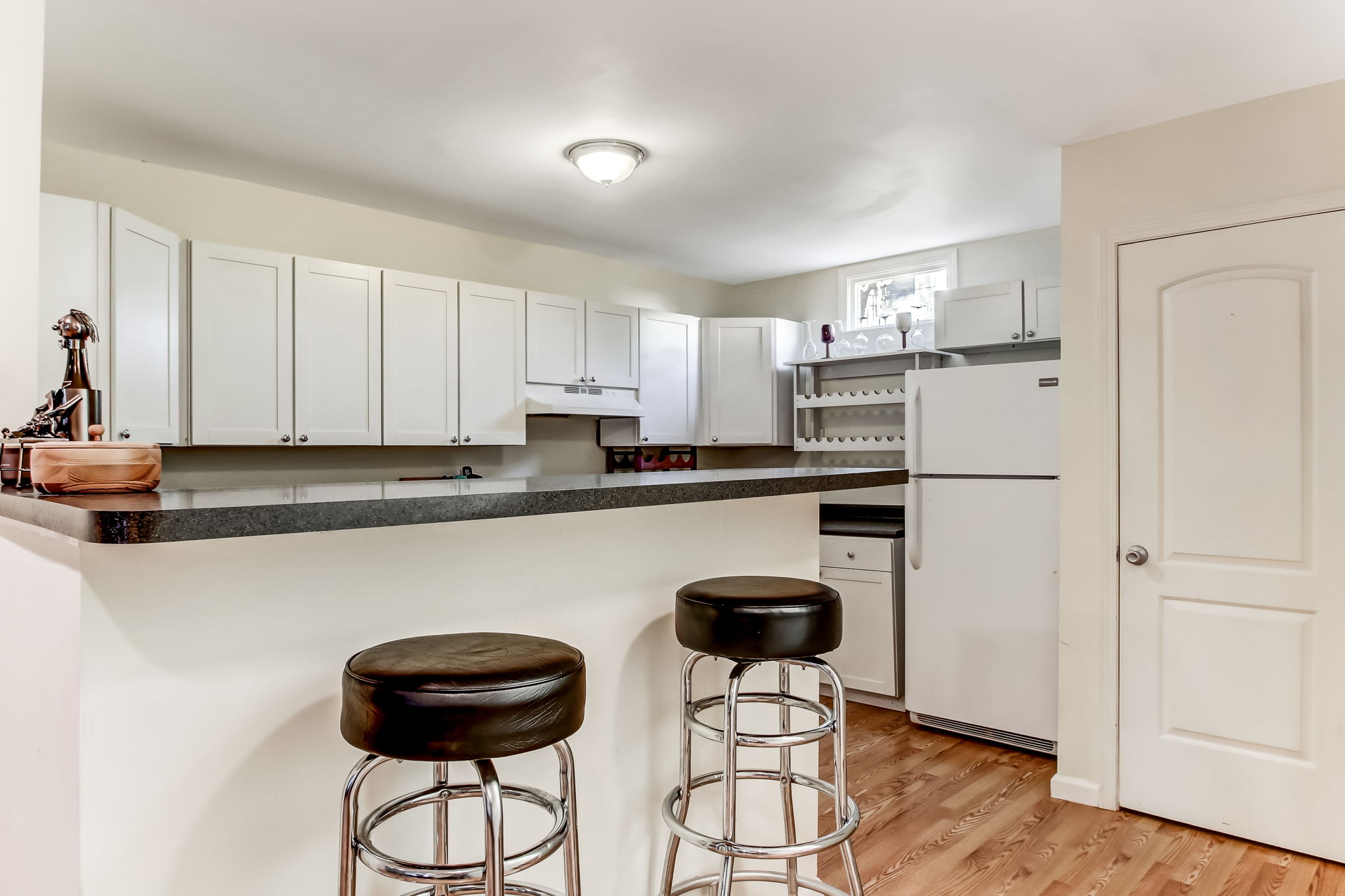 Fully equipped kitchen with beautiful wood flooring at 1208 Habersham St (Carriage House)