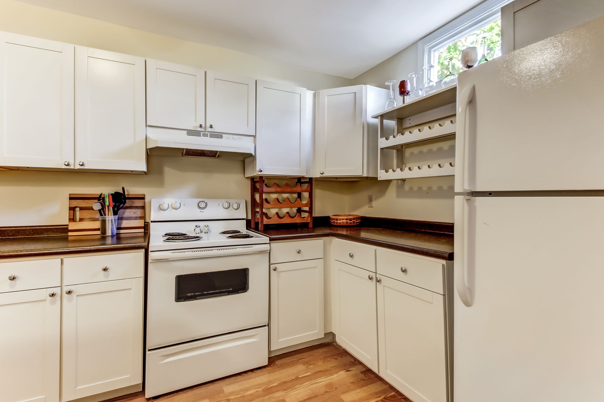 Fully equipped kitchen with beautiful wood flooring at 1208 Habersham St (Carriage House)