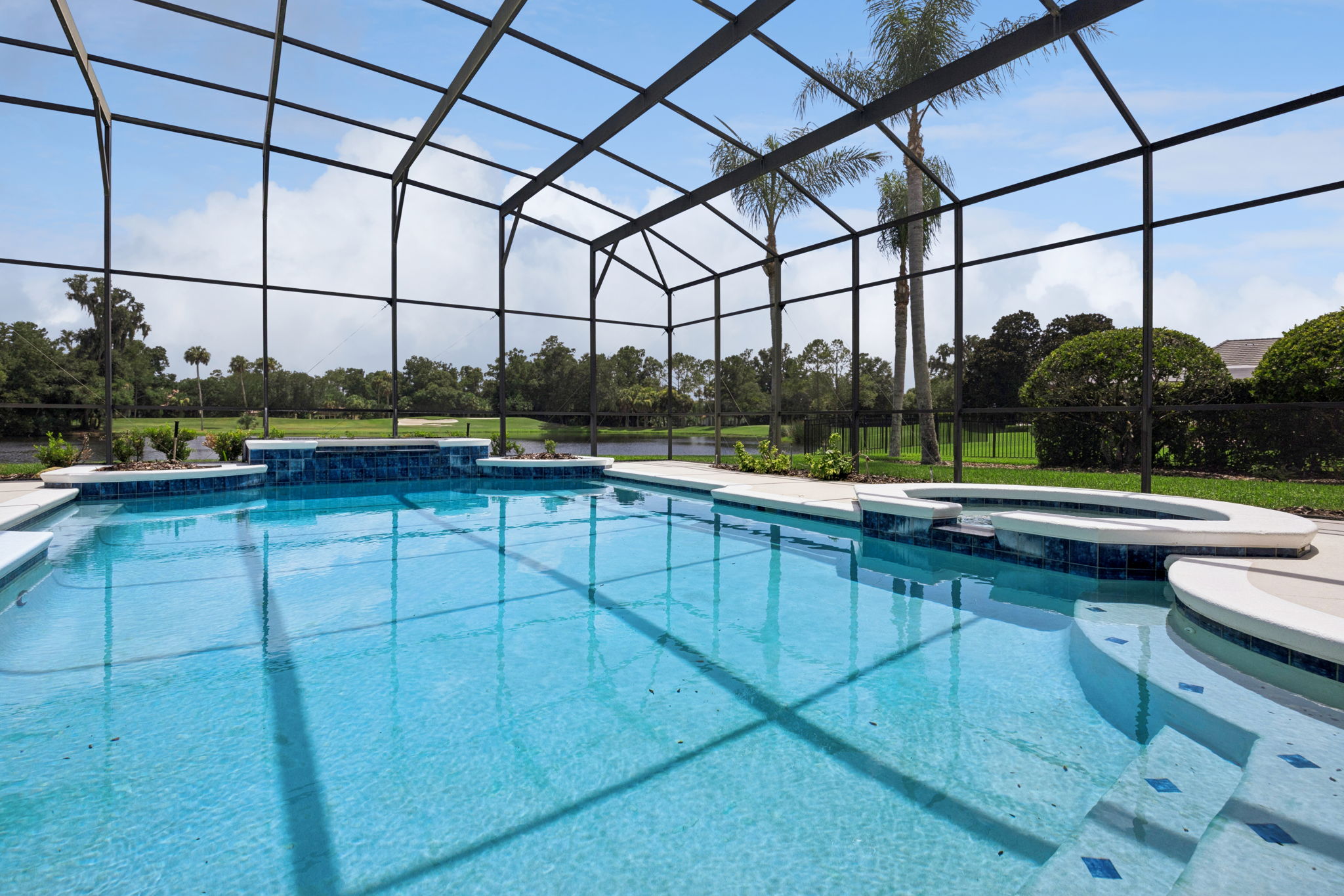Pool and spa with beautiful water and golf view