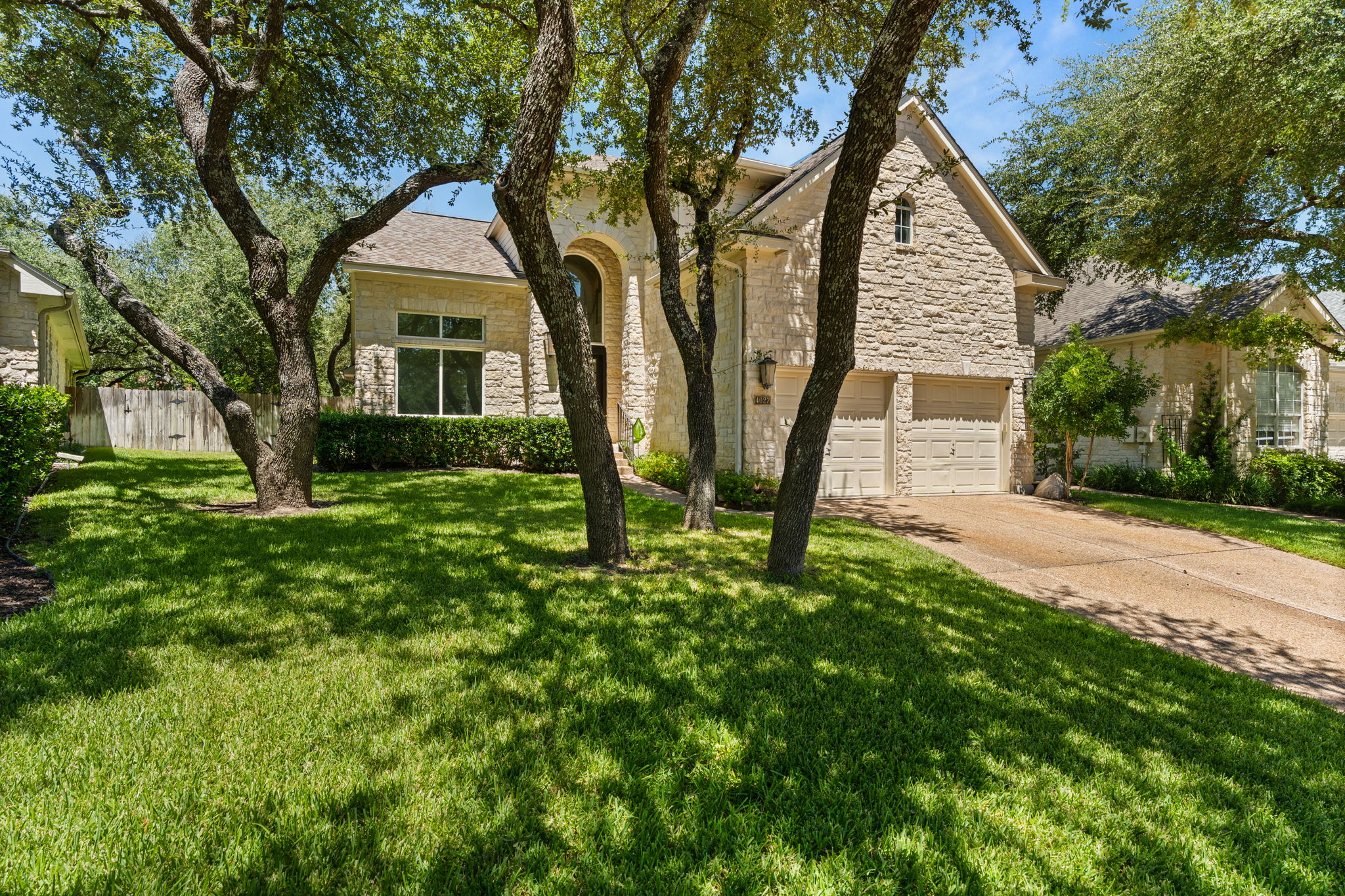 Tree-covered lot in prestigious golf course community.