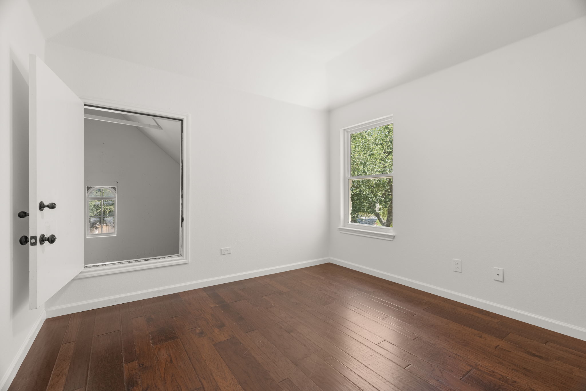 1 of 3 upper-level bedrooms. Entrance to the nook in the bedroom to the right of the top of the stairs.