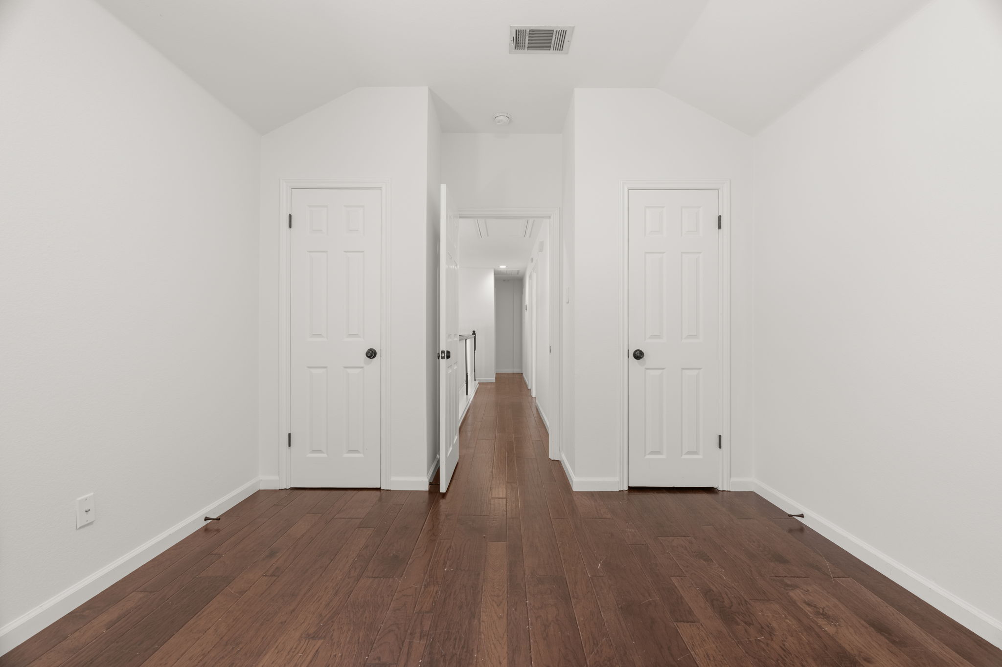 1 of 3 upper-level bedrooms. This is to the right of the top of the stairs has two closets and a great nook.
