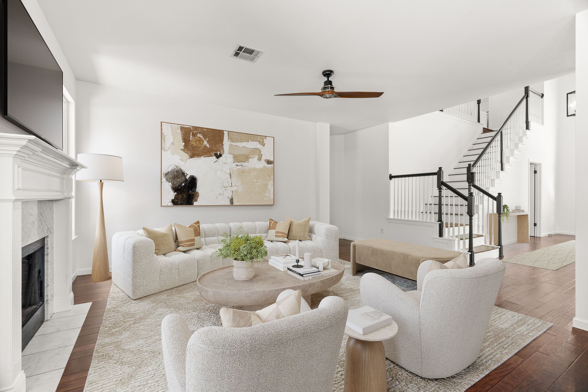 Virtually staged. The back living space is perfect for relaxing and gazing into the lush back yard.