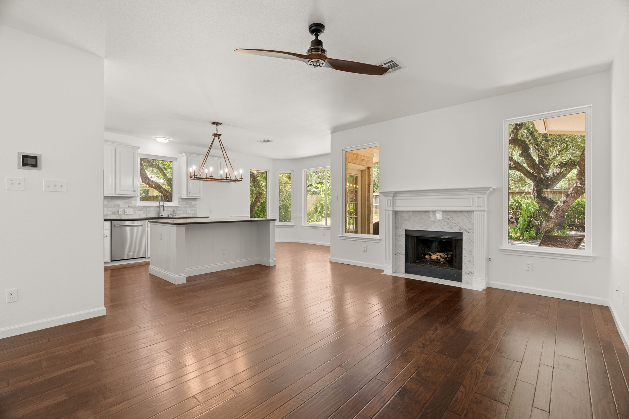 The expansive lower level has soaring windows that flood the open floor plan with natural light.