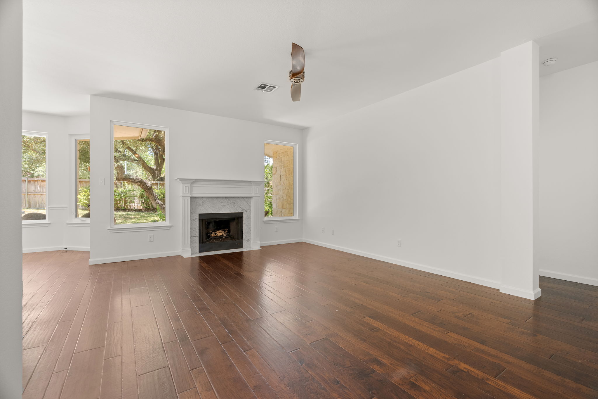 The back living space is perfect for relaxing and gazing into the lush back yard.
