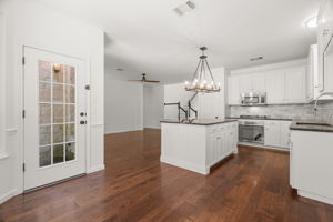 The door to the large and fenced back yard is conveniently located near the kitchen and breakfast area.