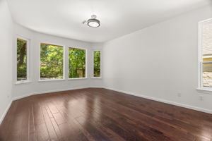 The primary suite overlooks the lush back yard.