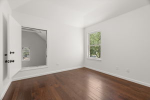 1 of 3 upper-level bedrooms. Entrance to the nook in the bedroom to the right of the top of the stairs.