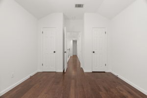 1 of 3 upper-level bedrooms. This is to the right of the top of the stairs has two closets and a great nook.
