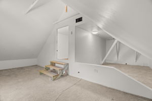 1 of 3 upper-level bedrooms. The nook in the bedroom to the right of the top of the stairs.