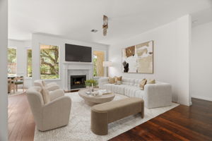 Virtually staged. The back living space is perfect for relaxing and gazing into the lush back yard.