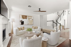 Virtually staged. The back living space is perfect for relaxing and gazing into the lush back yard.