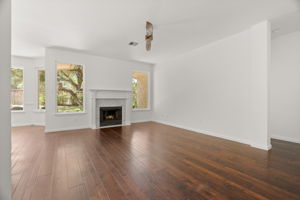 The back living space is perfect for relaxing and gazing into the lush back yard.