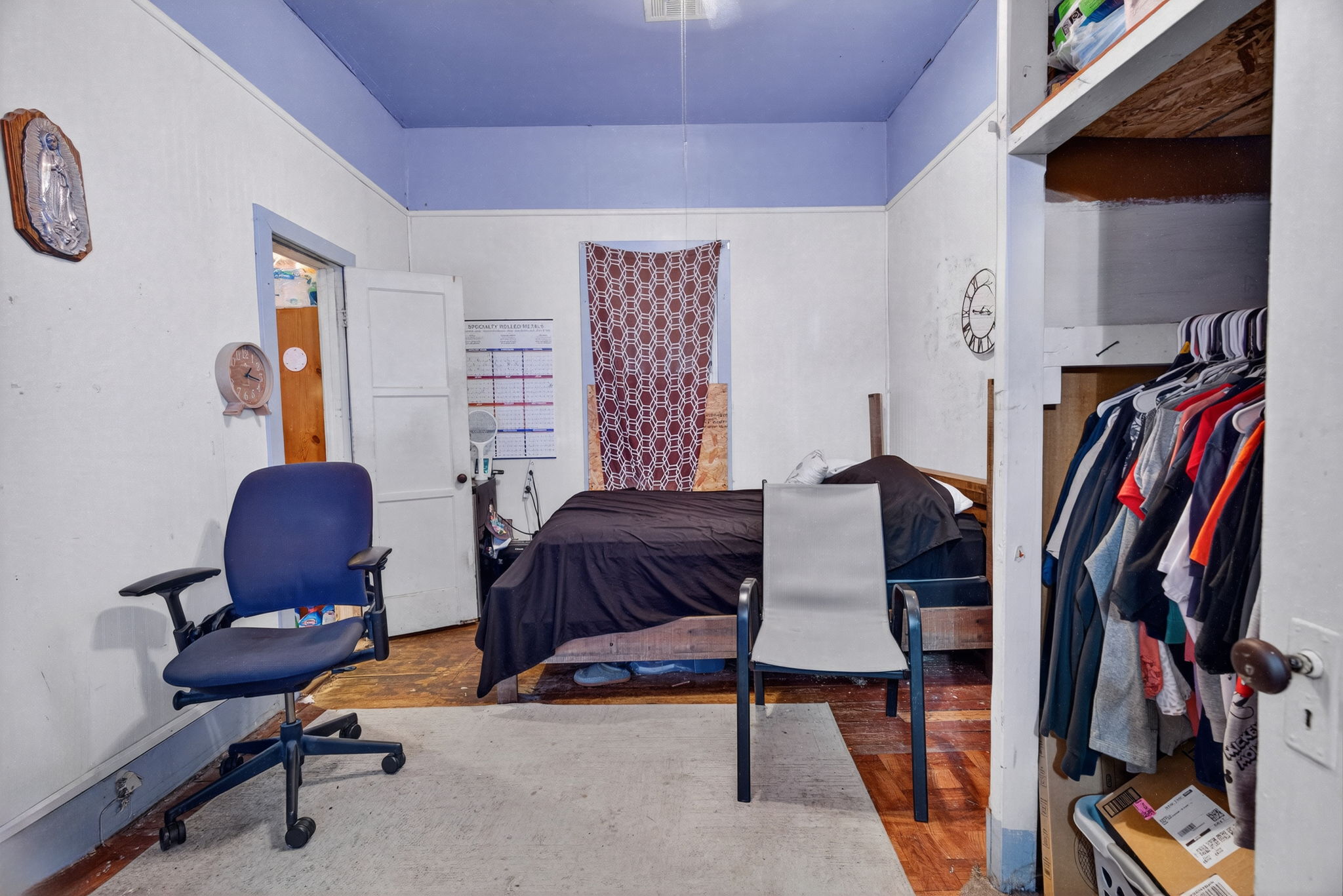Bedroom with hardwood floors.