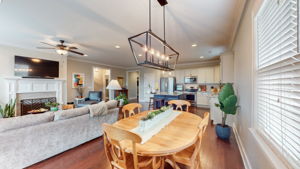The custom lighting throughout this home is on display in this dining area.