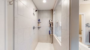 The extra large tiled shower is roomy and features easy in/out access.