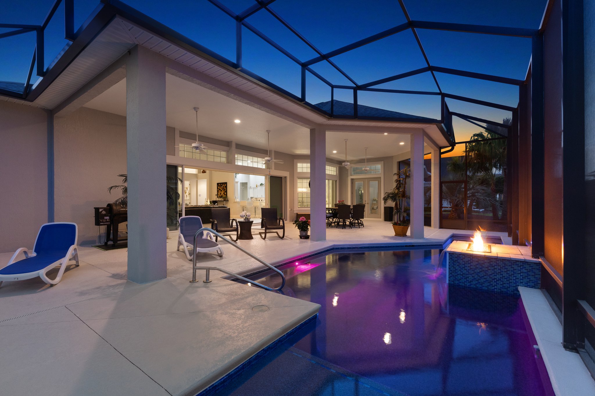 Twilight Swimming Pool with Waterfall and Fire Feature