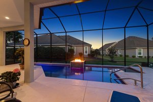 Twilight Swimming Pool with Waterfall and Fire Feature
